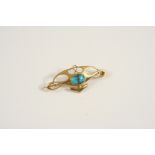 AN ART NOUVEAU TURQUOISE AND GOLD BROOCH BY MURRLE, BENNETT & CO. the 15ct. gold openwork design