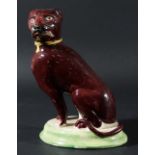 STAFFORDSHIRE FIGURE OF A SEATED DOG, mid 19th century, facing sinister, with a maroon/brown coat