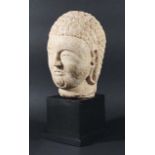 CHINESE WHITE MARBLE HEAD OF BUDDHA, Northern Qi, carved with dense, tight curls, pendulous ears and