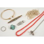 A QUANTITY OF JEWELLERY including a diamond and pearl set brooch, 3.5cm. long, a coral bead