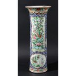 CHINESE FAMILLE ROSE SLEEVE VASE, circa 1900, enamelled with panels of flowers on a blue and