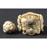 JAPANESE IVORY NETSUKE, 19th century, carved with eight masks including a monkey, eagle and human