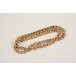 A 9CT. GOLD CURB LINK WATCH CHAIN 34cm. long, 15.6 grams.