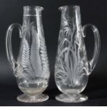 NEAR PAIR OF GLASS JUGS, late 19th century, probably Stourbridge, of baluster form engraved with