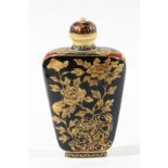 IVORY AND LACQUERED SNUFF BOTTLE, probably Chinese, 19th century, decorated with a figure in a