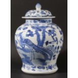 CHINESE BLUE AND WHITE JAR AND COVER, Qianlong style but later, painted with exotic pheasants and