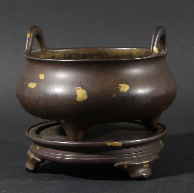 CHINESE BRONZE AND GOLD SPLASH CENSER AND STAND, Xuande mark but later, of circular, two handled,