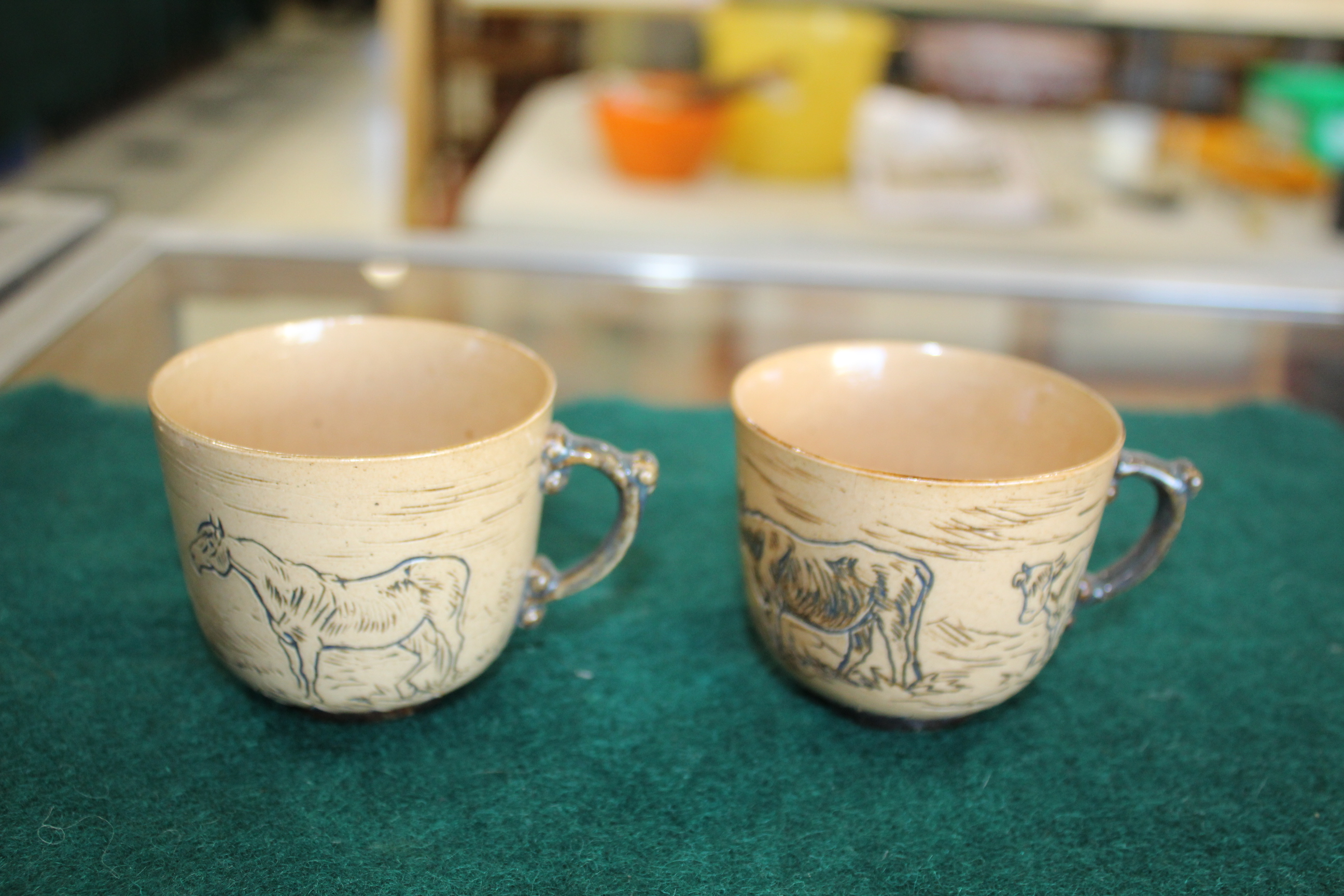 HANNAH BARLOW - PAIR OF CUPS & SAUCERS including two saucers with a blue border, with a scraffito - Image 6 of 11