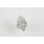 A DIAMOND CLUSTER RING the marquise-shaped ring is set overall with graduated circular-cut diamonds,