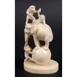 JAPANESE IVORY OKIMONO, Meiji, carved as an elephant and three monkeys balancing on a ball, height