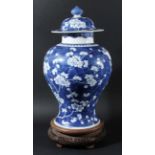 CHINESE BLUE AND WHITE PRUNUS VASE AND COVER, of baluster form, with ruyi to the neck, blue double
