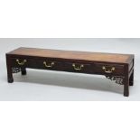 CHINESE HARDWOOD LOW TABLE, the rectangular top above four drawers, floral carved brackets and