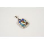 AN ARTS AND CRAFTS ENAMEL LOCKET PENDANT with blue and green enamel decoration to the front