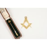 AN 18CT. GOLD MASONIC PENDANT 5cm. high, 7.6 grams, together with a 15ct. gold Masonic stick pin,