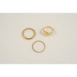 A 22CT. GOLD WEDDING BAND 3.3 grams, size K, together with an 18ct. gold wedding band, 0.6 grams,