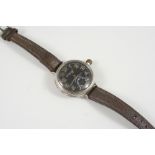 A MILITARY SILVER WRISTWATCH BY BIRCH & GAYDON LTD. the signed black dial with Arabic numerals and