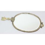 JAPANESE BRASS OVAL MIRROR, late 19th century, the bevelled glass inside a frame cast with dragons