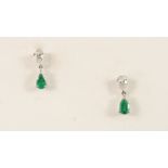 A PAIR OF EMERALD AND DIAMOND DROP EARRINGS each set with a pear-shaped emerald drop suspended