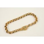 A VICTORIAN GOLD BRACELET the circular gold links with embossed decoration with a gold hand clasp