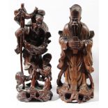 GROUP OF FOUR CHINESE WOODEN FIGURES, late 19th or early 20th century, with glass eyes and ivory
