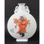 CHINESE MOON FLASK, blue painted with a man looking in a mirror to one side and iron red painted