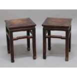 PAIR OF CHINESE HARDWOOD STANDS, late 18th century, the square top above shaped stretchers on square
