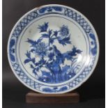 CHINESE BLUE AND WHITE CHARGER, probably 19th century, painted with a bird in flowering branches,