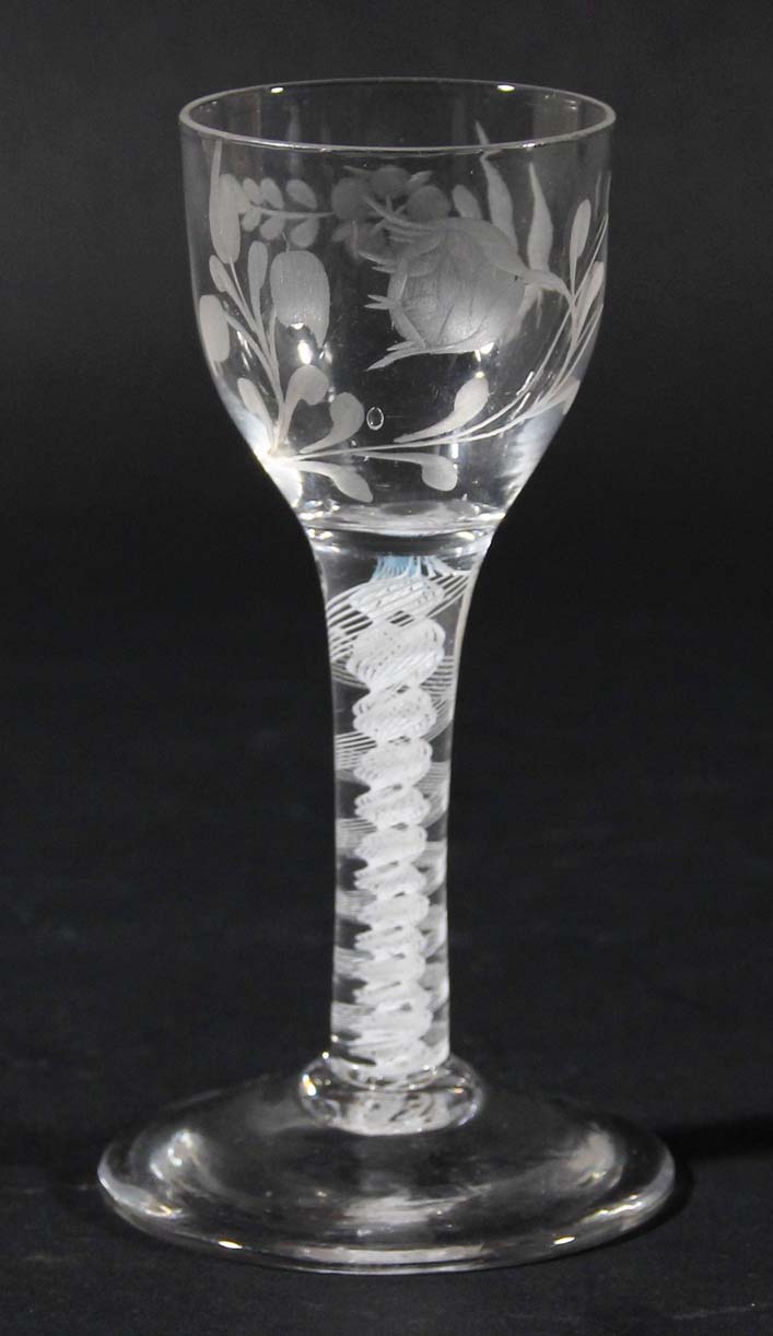 ENGLISH WINE GLASS, circa 1790, the ogee bowl engraved with a rose and other foliage on a stem