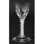 ENGLISH WINE GLASS, circa 1790, the ogee bowl engraved with a rose and other foliage on a stem