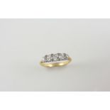 A DIAMOND FIVE STONE RING the five graduated old brilliant-cut diamonds are set with rose-cut