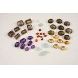 A QUANTITY OF LOOSE GEM STONES including citrine, amethyst, smoky quartz, and opal.