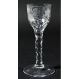 ENGLISH WINE GLASS, circa 1780-90, the rounded funnel bowl with faceted base, engraved with fruiting
