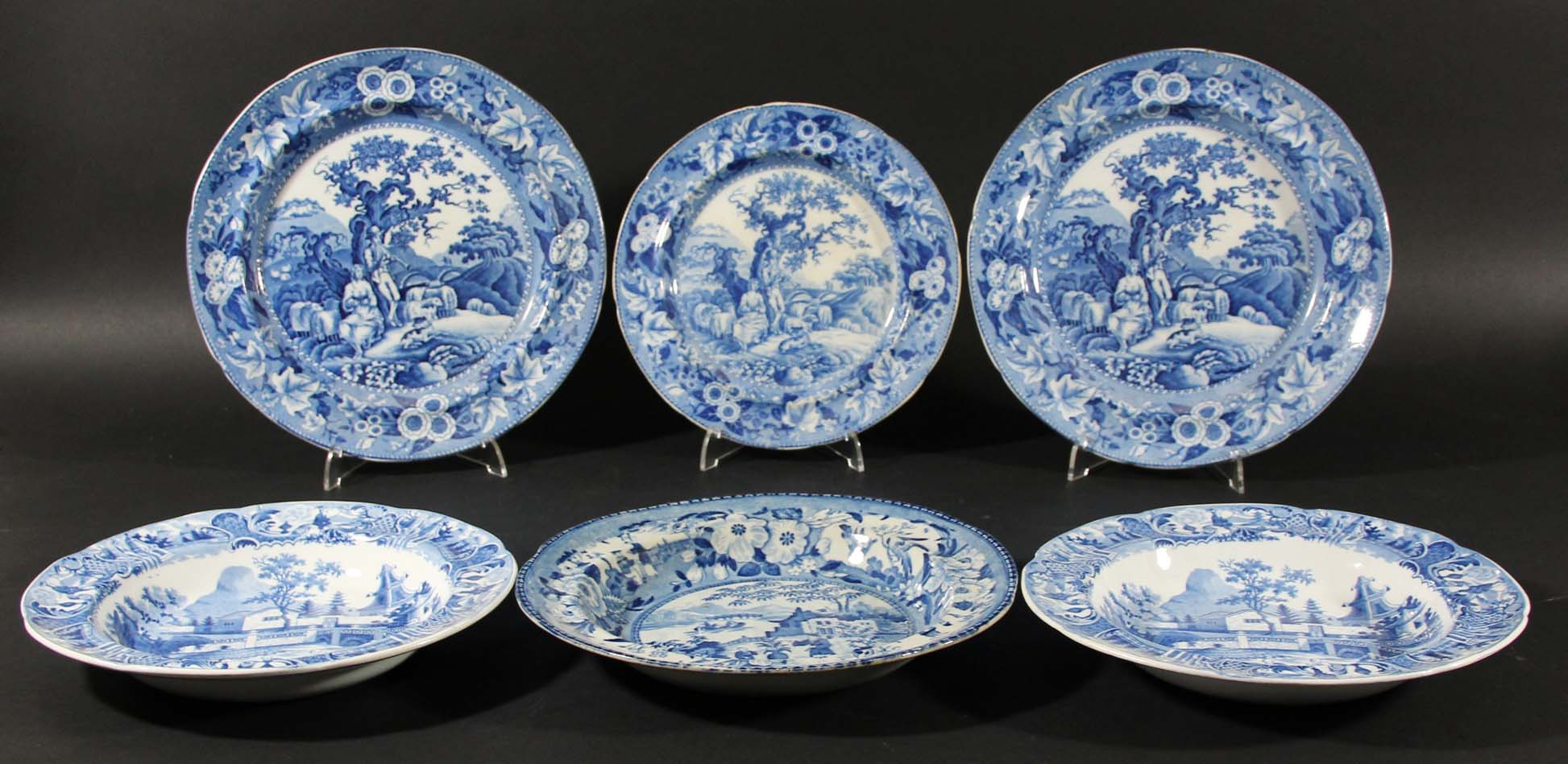 THREE BLUE TRANSFER PRINTED PLATES, early 19th century, in the Piping Shepherd pattern, diameter