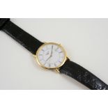 AN 18CT. GOLD WRISTWATCH BY LONGINES the signed circular dial with Roman numerals and date aperture,