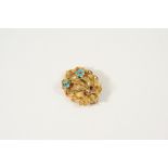 A VICTORIAN GOLD AND TURQUOISE BROOCH the oval-shaped brooch with gold embossed foliate