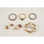 AN AMETHYST AND GOLD WISHBONE BROOCH set with a circular amethyst in 9ct. gold, together with a pair