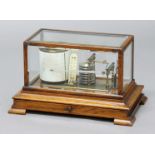OAK CASED BAROGRAPH, early 20th century, with brass, clockwork chart drum, stack of eight silvered