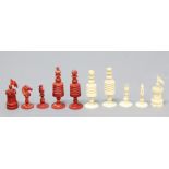 TURNED BONE CHESS SET, late 19th century, red stained and natural, height of king 9cm, height of