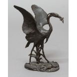 AFTER JACQUEMART, Heron with a fish on a naturalistic base, brown patinated bronze, height 23cm