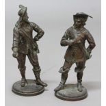 PAIR OF BRONZE FIGURES OF CAVALIERS, modelled standing, hand on hip, on circular bases, height