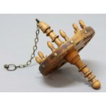 FRENCH FRUITWOOD HANGING SPOON RACK, the circular holder with twelve slots on a central turned