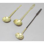 COLLECTION OF THREE BRASS LADLES, 18th century, one with an iron handle and copper rivets, one