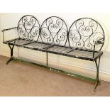 PAINTED WROUGHT IRON THREE SEAT GARDEN BENCH, the arched back with scrolled decoration above the