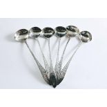 A SET OF SIX GEORGE III IRISH PROVINCIAL SALT SPOONS Bright-cut, with pointed ends, crested, by