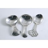 THREE HANDMADE CADDY SPOONS:- One with punched decoration in the bowl & up the stem by Messrs.