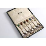 AN EARLY 20TH CENTURY CASED SET OF SIX COFFEE SPOONS with coloured hardstone "bead" terminals, by