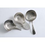 SHEFFIELD:- Three George III caddy spoons with fluted shell bowls to include a Bead pattern example,