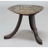 THEBES STOOL probably retailed by Liberty & Co, made in oak with a dish shaped top and supported