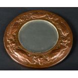NEWLYN STYLE ARTS & CRAFTS MIRROR a circular copper mirror, with a raised design of Fish around