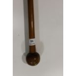 A ZULU KNOBKERRIE etc A hardwood Zulu youths knobkerrie, of some 34.1/2" length with a leather